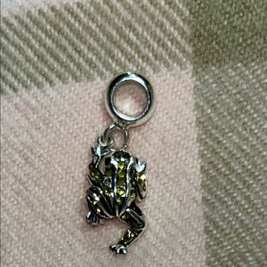 Cute little from charm with yellow crystals.